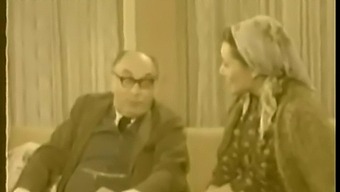 A Couple'S Passionate Kissing And Sensual Encounter In A 1979 Film
